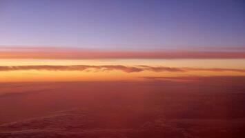 A view of the sunset from an airplane photo