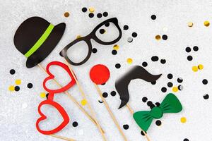 Fun party props on a sparkling background for creative celebrations or events photo