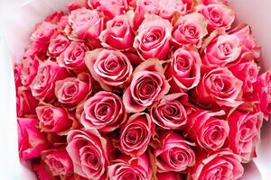 Pink 51 roses arranged beautifully in a bouquet for a special occasion in daylight photo