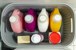 A plastic container filled with different colored containers photo