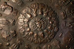 bronze aegis with the gorgon Medusa in the center and Greek mythological gods photo