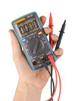 Digital multimeter on white photo
