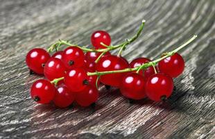 Red Currant on wood photo