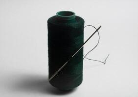 single thread spool with needle confection photo