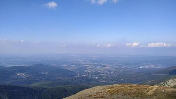 Panoramic view of krkonose mountains from snezka peak in czechia in august photo