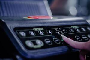 Setting the pace for fitness Entering workout metrics on treadm photo