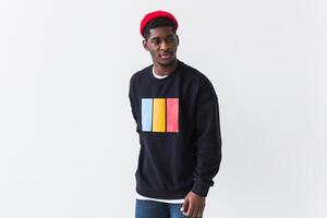 Young handsome african american man with an afro hairstyle. Portrait on white background with copyspace. Guy looking aside. photo