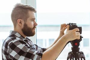production, shooting advertising and content for social networks - Operator working with a camera. photo
