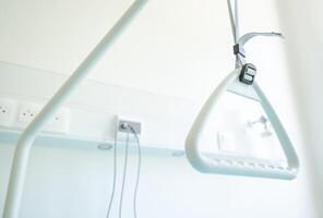 Grab Bar for Assistive Use in a Bright, Clean Medical Facility Room During Daylight Hours photo