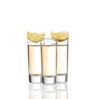 Three shot glasses with lemon slices photo