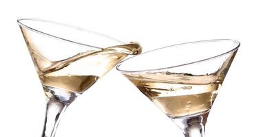 Two champagne flutes with liquid in them photo