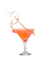 A red liquid splashing into a glass photo