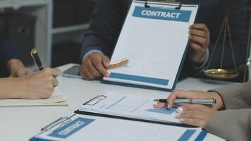 Contracts and business people at a table video