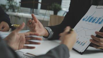 Business people discussing business strategy and financial data video