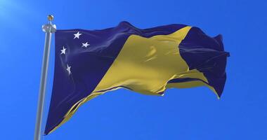 Tokelau flag waving at wind in slow with blue sky, loop video