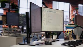 Advanced AI algorithms running on computer monitors in startup workspace deploying machine learning models. Coding platform on PC screens in Silicon Valley office, close up shot photo