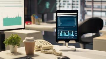 Empty office workspace with advanced technology to enhance efficiency, helping business professionals focus on financial strategies. Global enterprise success objectives. photo