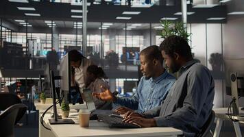Corporate team collaborate on global investment strategy, employing extensive business expertise to work on data driven decisions. Solving administrative tasks for efficiency. Camera B. photo