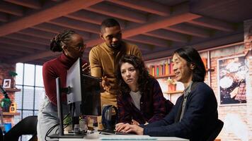 Startup team in office disappointed after watching stock exchange declining because of market volatility. Upset venture workers analyzing charts, seeing stock valuation drop, camera B photo