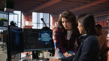 Startup engineer asks team leader questions before starting to implement machine learning. Artificial intelligence tech venture employee requests help from manager to fix code bugs, camera A photo