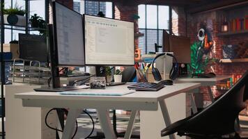 Empty AI tech agency providing custom software development services. Technology venture workspace using machine learning to streamline coding process in startup office, jib down shot photo