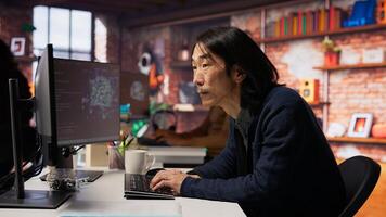 Software engineer in business workspace using computer to oversee artificial intelligence neural networks. Person in tech startup office using AI machine learning systems on PC, camera B photo