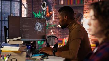 Startup company developer fixing applications issues, dealing with databases and server configuration. Man in office optimizing software for improved performance and scalability, camera B photo