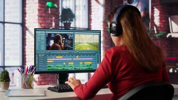 Focused editor works on montage in creative software at home, digital media. Filmmaker using dual monitors to edit footage and create content, post production. Camera A. photo