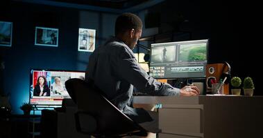 Editor working on creative software to create montage, using color correction and adding visual effects. Content creator editing graphics and gradient for movie post production. Camera A. photo