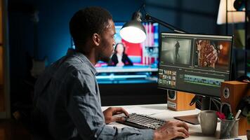 Videographer working on editing film footage at home, doing freelance contract for post production scenes. Editor correcting white balance and color grading using pc software. Camera B. photo