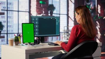 Freelancer interacting with AI virtual assistant next to mockup screen, using innovative chatbot interface. Machine learning enhances productivity through advanced algorithms. Camera A. photo