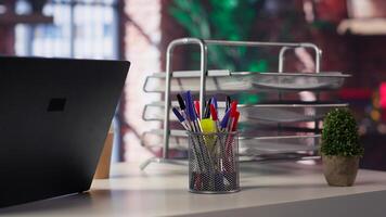 High end home office with empty desk. Sleek neutral design and artistic details creates refined comfortable workspace with upscale, creative feel. photo