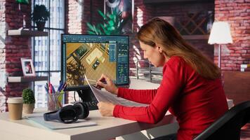 Remote worker in creative office uses CAD software and blueprints plan, to design house interior and provide user interface for virtual home customization. Detailed architectural layout. Camera B. photo