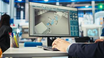 Factory engineer using program on PC to improve solar panels efficiency. Photovoltaics manufacturing plant worker researching cheaper energy solutions using computer, camera A close up photo