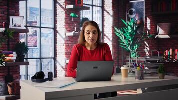 Female applicant at virtual interview via online call, applying for job vacancy listed on web recruiting platform. Ambitious woman looking to get hired, job offer. Camera B. photo