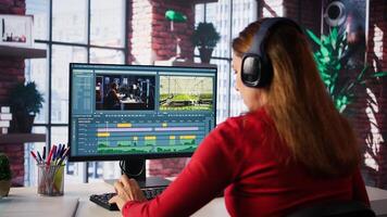 Female filmmaker working on media post production from agency office, editing timeline and color correction for shoot. Tech driven workspace showcases workflow. Camera B. photo