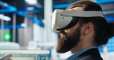 Engineer using VR gear to optimize layouts using CAD software. Photovoltaics factory worker using virtual reality tech to do arrangements for maximum energy output, camera B photo