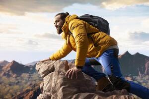 Traveler enjoys solitude of mountain summit, where panoramic view represents adventure and personal growth. Hiker with outdoor gear feeling cold on windy mountain top. photo