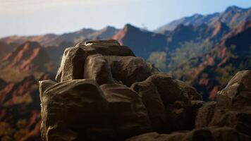 Picturesque mountain summit with rocky foreground showcasing raw beauty of nature. A true haven for those who crave the freedom and thrill of trekking through remote alpine regions. photo