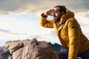 Trekker embracing challenge of mountain hiking with fresh air and epic view serving as reminder of personal strength and thrill of conquering fears. Seeking adventure. photo