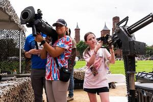 People attend a festival marking the 250th anniversary of the U.S. Army on the National Mall in Washington, D.C., before the military parade on June 14, 2025. editorial_image