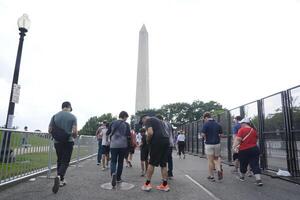 People wait in line to go through security checkpoints before entering a celebration marking the 250th anniversary of the U.S. Army in Washington, D.C., on June 14, 2025. editorial_image
