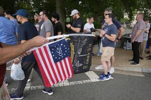 People wait in line to go through security checkpoints before entering a celebration marking the 250th anniversary of the U.S. Army in Washington, D.C., on June 14, 2025. editorial_image