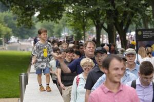 People wait in line to go through security checkpoints before entering a celebration marking the 250th anniversary of the U.S. Army in Washington, D.C., on June 14, 2025. editorial_image