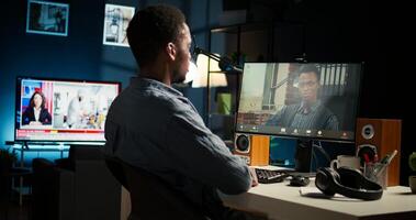 Black remote worker meeting with team leader via conference call, sharing ideas and insight on tasks from home office setup. Young adult joining web chat with boss. Camera A. photo