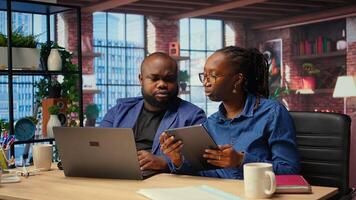 Independent people using devices for remote job tasks at home, surrounded by digital tools and enjoying benefits of schedule flexibility. Modern freelancing lifestyle. Camera B. photo
