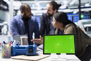 Multiethnic group of technicians work with copy space in a solar energy plant, shares ideas on improving systems and emphasizing strategic planning for technical development. photo