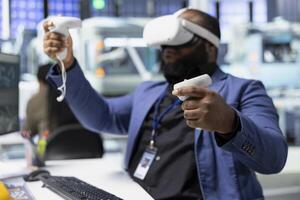 Photovoltaics factory engineer using VR tech to build models of alternative energy generators. Solar panels plant female employee building safe solar cells using virtual reality gear. photo