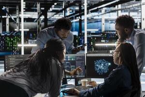 Data center engineering team implements AI virtualization frameworks to optimize server clusters. Teamworking server hub colleagues do artificial intelligence predictive analysis photo