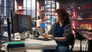 Female system admin doing maintenance on AI brain pc systems, sitting at office desk. Girl works as a software developer with cybernetics and algorithms for machine learning. Camera A. photo